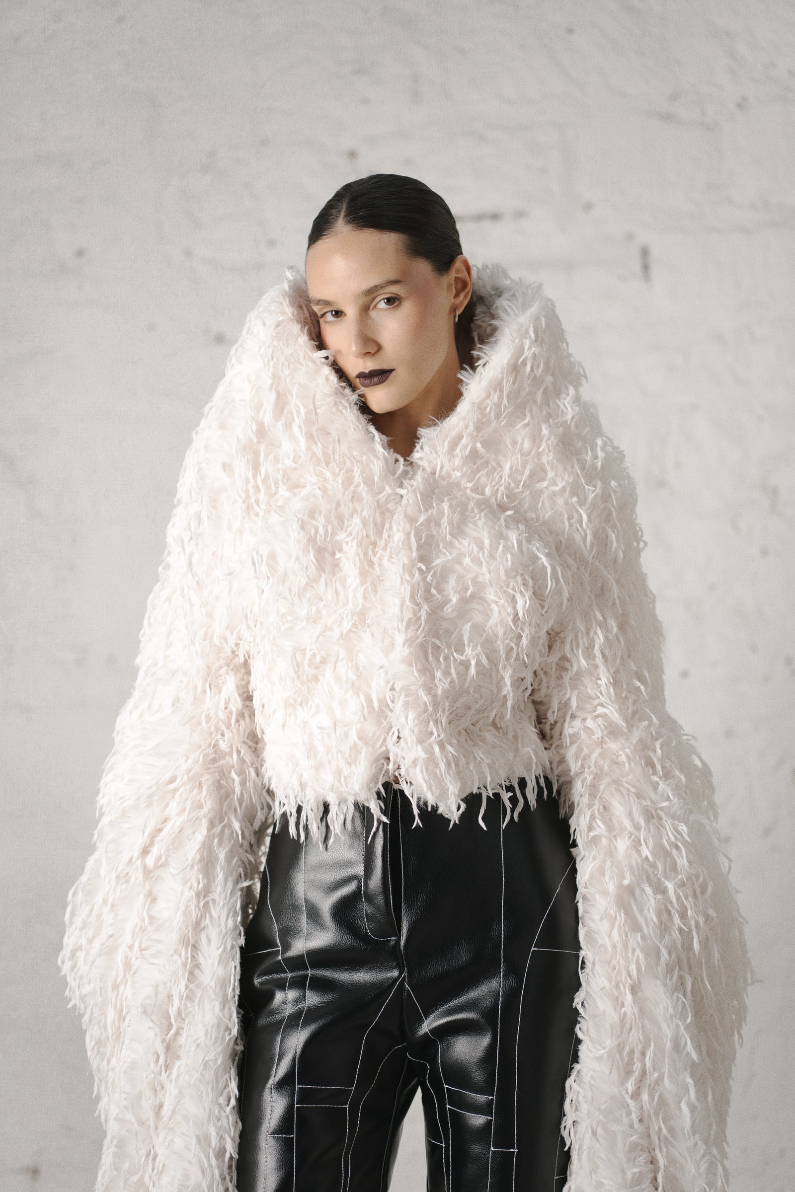 Fashion portrait with sculptural white textile by Katrina Dobbermane